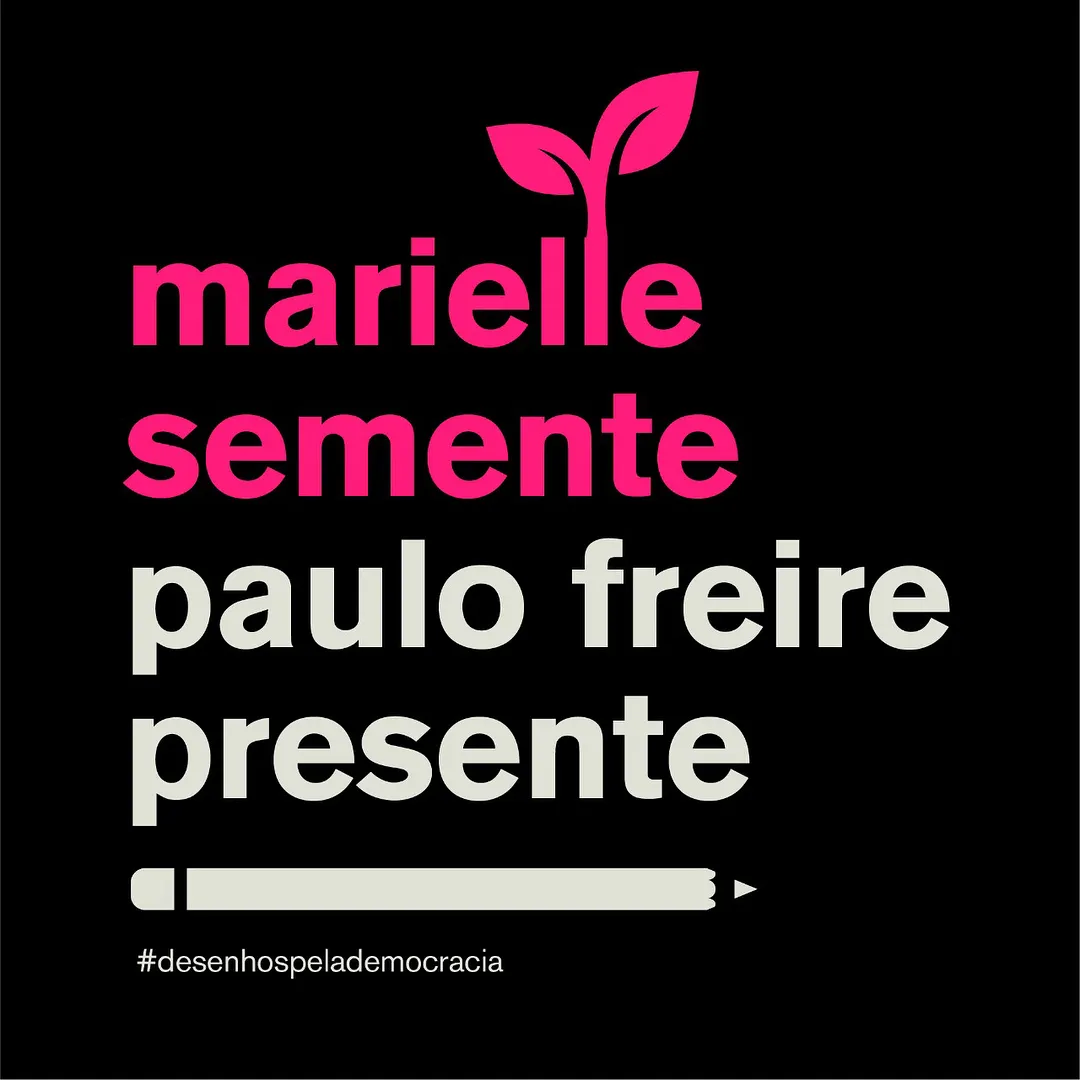 Fundo preto com um broto rosa desenhado no topo. Em letras rosas e claras: “marielle semente, paulo freire presente”. Abaixo, um lápis deitado e a hashtag desenhos pela democracia.